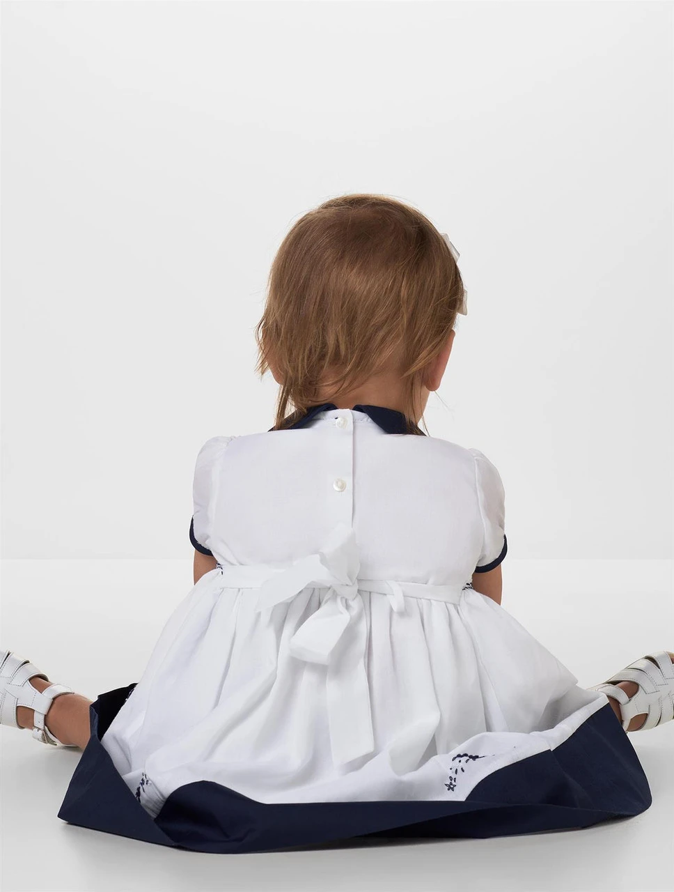 Sarah Louise Girls White & Navy Dress - Jenny 3 Sarah Louise Girls White & Navy Dress - Jenny - Image 2